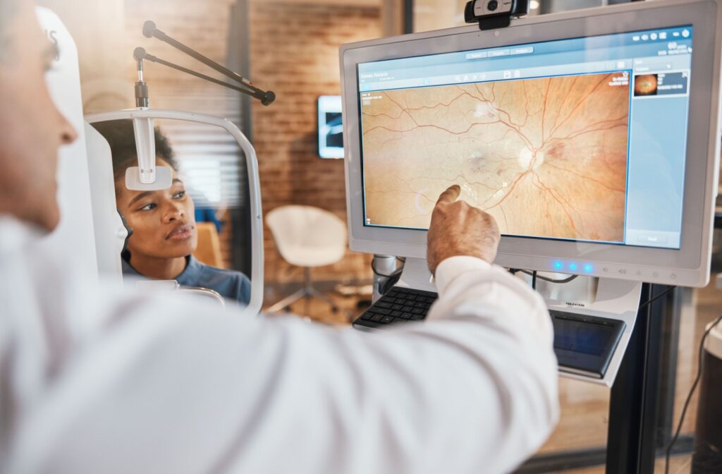 An eye doctor examines the findings from a patient's fundus photos.